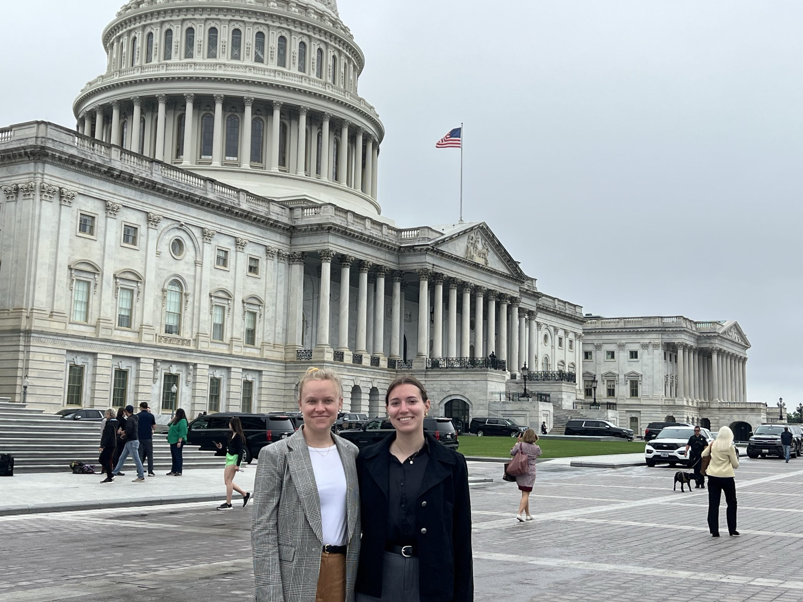 WDC staff stand in front of the Capitol building in Washington, DC.