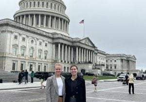 WDC staff stand in front of the Capitol building in Washington, DC.
